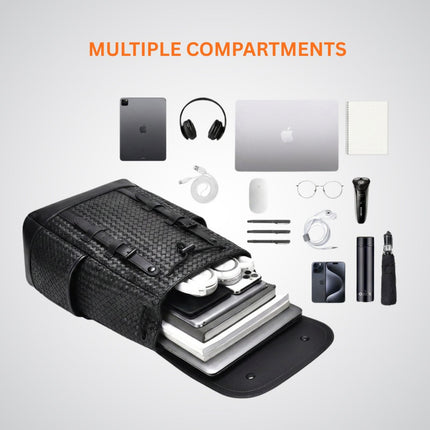 Black backpack with multiple compartments containing electronic devices and accessories on a light gray background.
