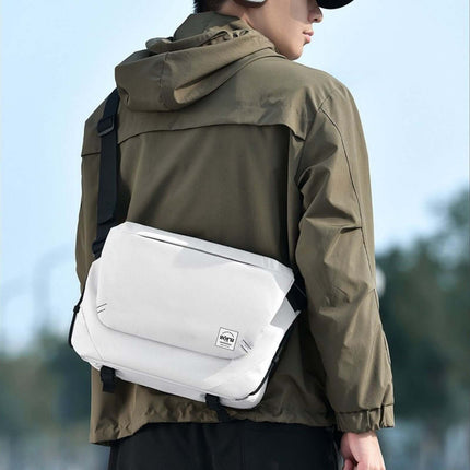 Hashiru Shoulder Bag and Cross Body Bag worn by a person in an urban setting, showcasing its stylish design and features.