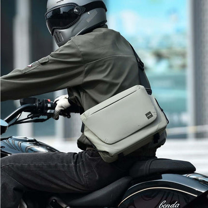 Hashiru Shoulder Bag and Cross Body Bag worn by a rider on a motorcycle, showcasing its waterproof design and stylish look.