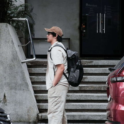 Sora Backpack for Biker, Mountain Climbing worn by a commuter in urban setting