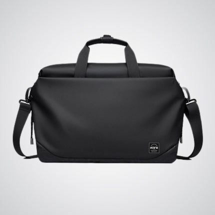 Black duffel bag with shoulder strap on a light gray background