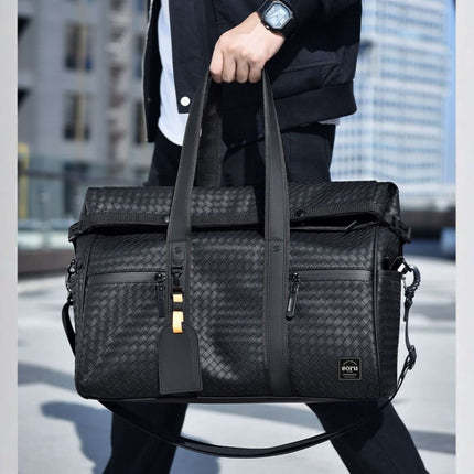 Limited Edition Kaze Woven Duffel Bag & Travel Bag being carried in an urban setting.