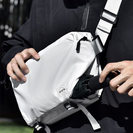 Man wearing Noroi Cross Body Bag for Men Waterproof, showcasing its stylish and functional design.