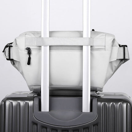 Noroi Cross Body Bag for Men Waterproof resting on a suitcase, showcasing its portable design.