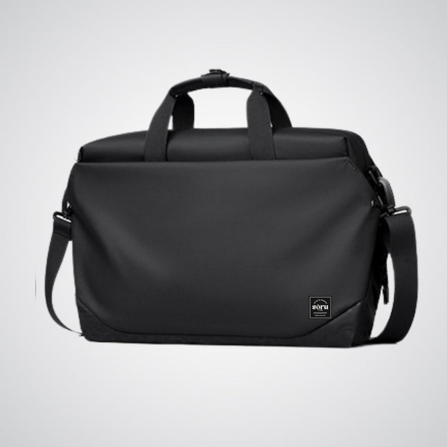 Black duffel bag with shoulder strap on a light gray background