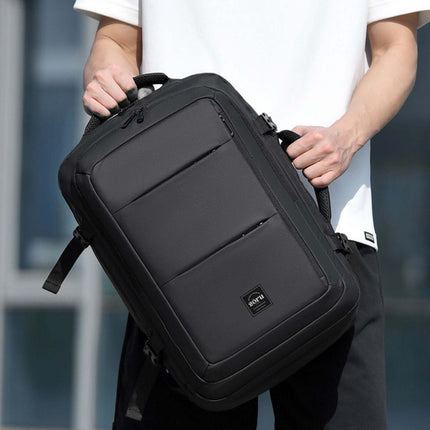 Jobu Backpack Waterproof Travel Bag held by a person, showcasing its sleek design and spacious compartments.