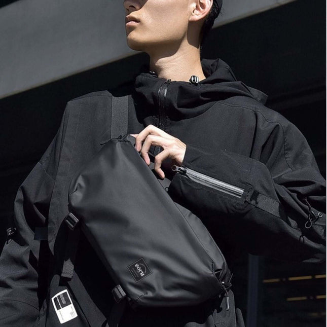 Noroi Shoulder Bag and Cross Body Bag worn by a model in a stylish black outfit